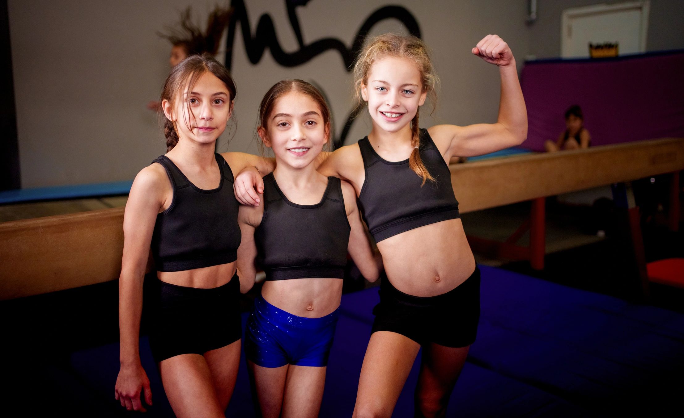 Young performers smiling together during training