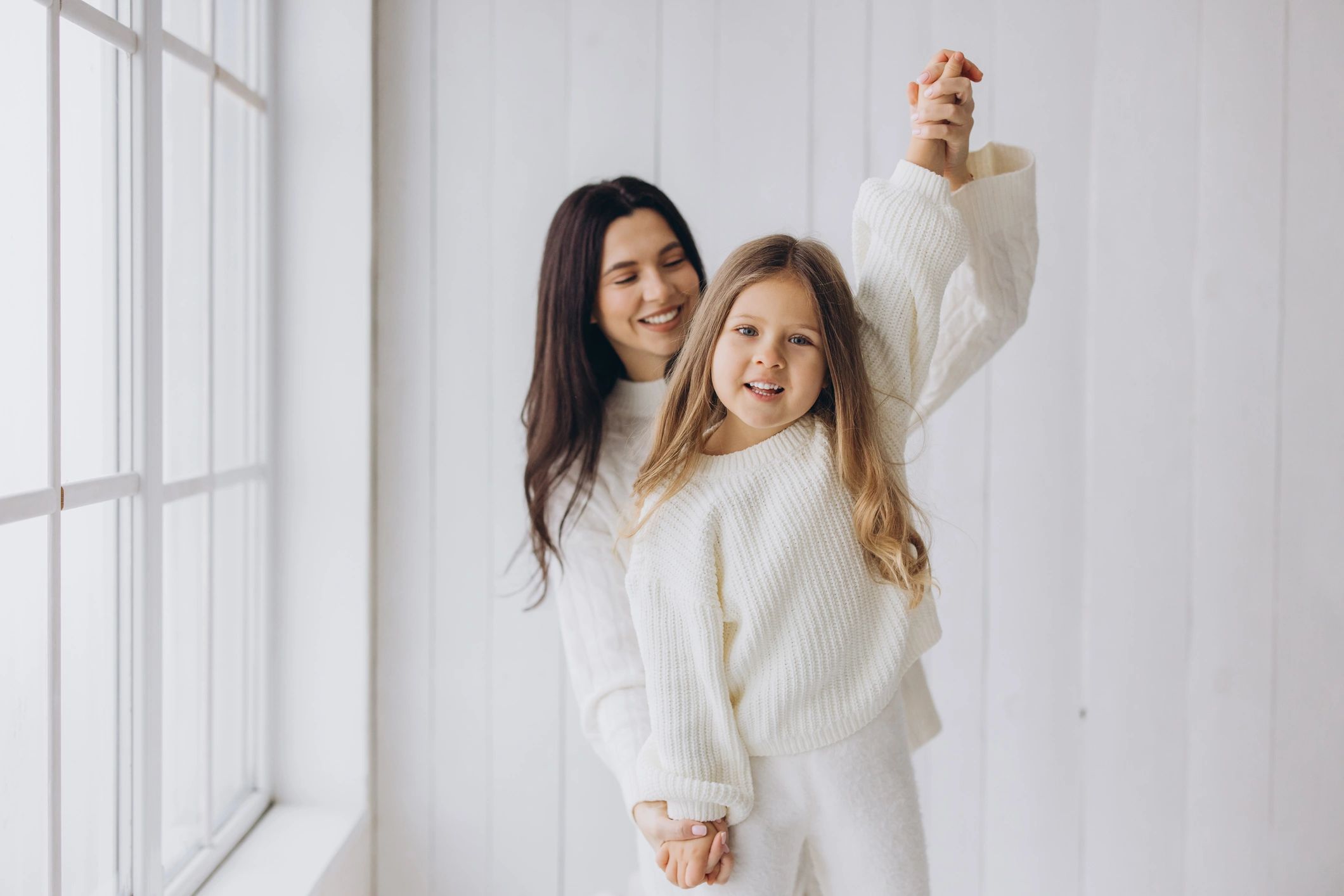 Mother and daughter sharing a joyful moment together